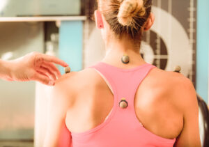 A posture assessment during a one-to-one personal training session in Tokyo.
